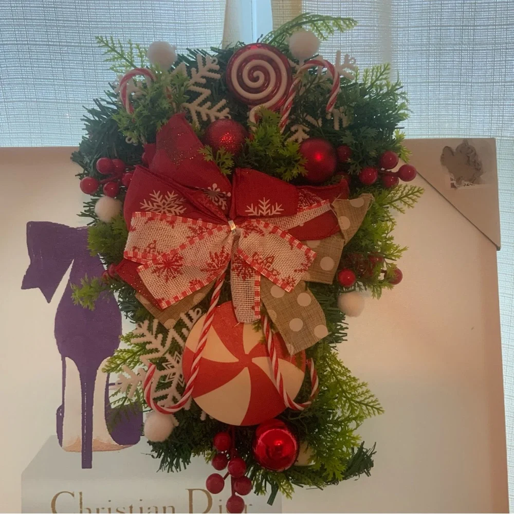 Holiday artificial Christmas teardrop swag for inside or outside decoration